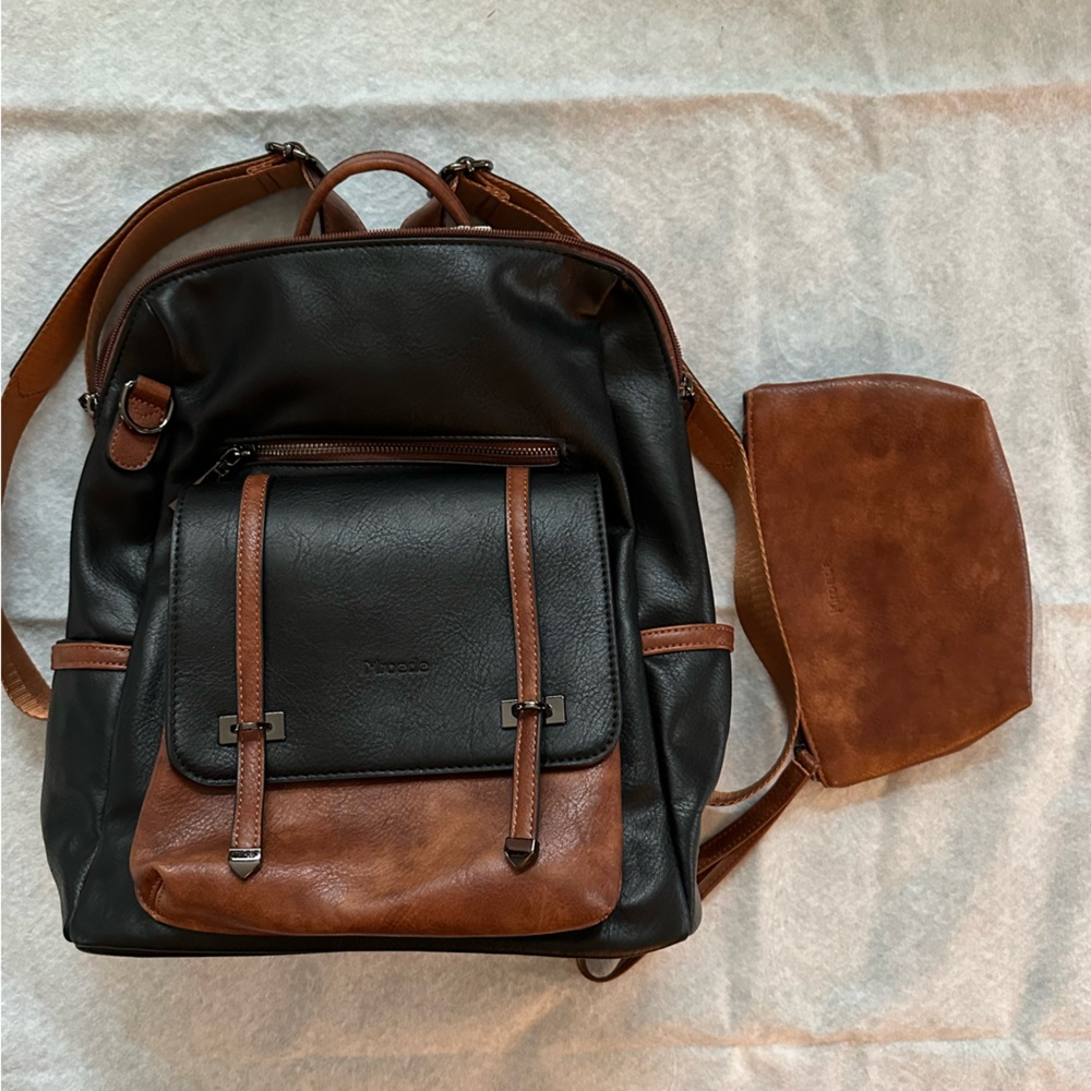 New Mroede Black and Brown Leather Backpack tote bag purse.  New without tags.